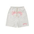 Men's loose grey cotton blend hip hop shorts with a cropped, street-style design on a neutral background.