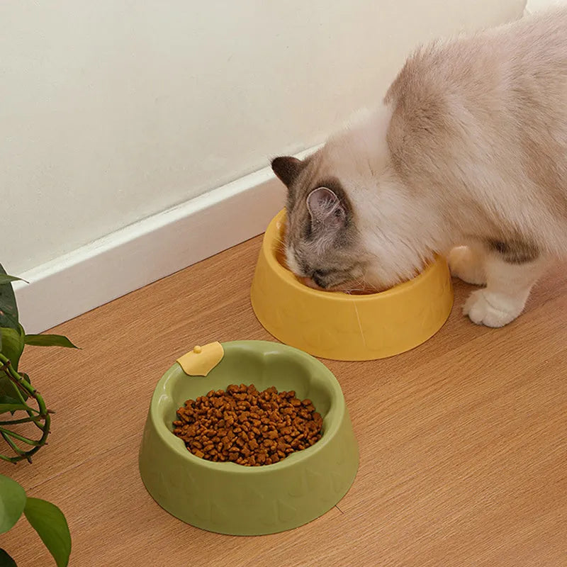 Green plastic double pet bowl with flower-shaped feeding areas and anti-tipping base design