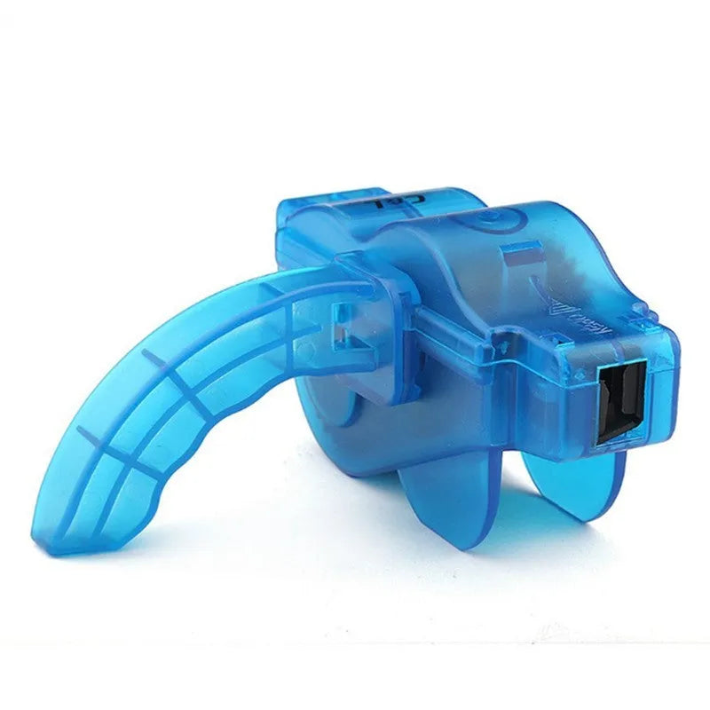 Blue plastic bicycle chain cleaning washer set with brushes on a bike chain