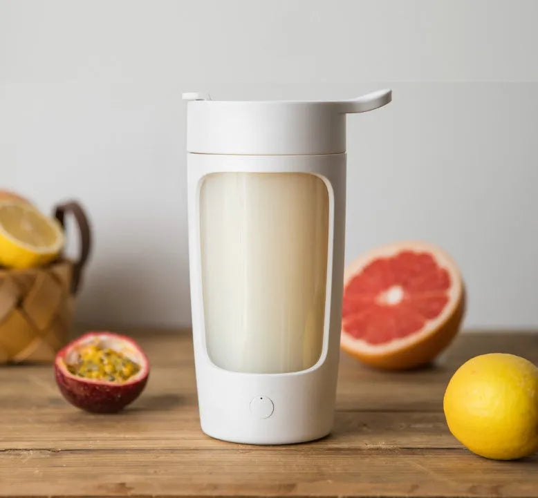 Portable white juice blender cup with 650ml capacity and USB charging port.
