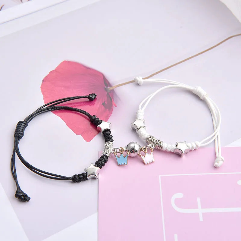 Alloy magnetic suction bracelet pair for couples with symbolic design options