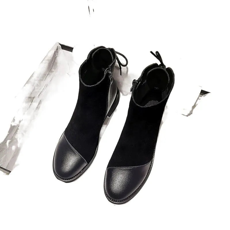 Black women's Martin boots with side zip, round toe, and knee-length shaft