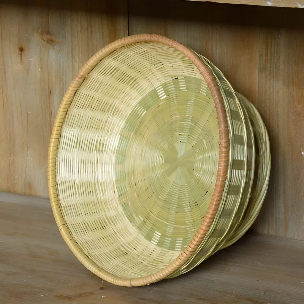 Handmade natural bamboo storage basket shown in one of three size variations for household organisation.