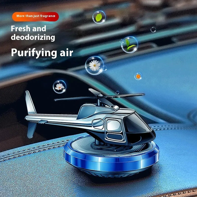 Silver solar-powered metal helicopter car ornament with rotating blades and air freshener function.
