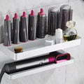 White double layer punch-free bathroom storage rack holding Marcel wavers and hair curlers