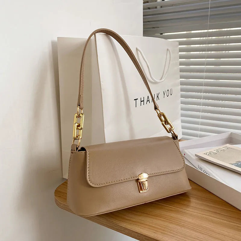 Brown PU leather underarm shoulder bag with square shape, sandwich pocket front and adjustable shoulder chain