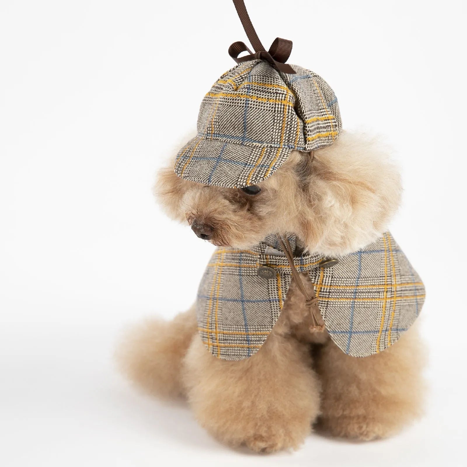 Camel-coloured detective suit style cotton cloak for a dog, featuring an adjustable hat.