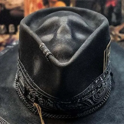 Handmade wool skull hat with conical crown and black and white embroidery for Halloween costumes.