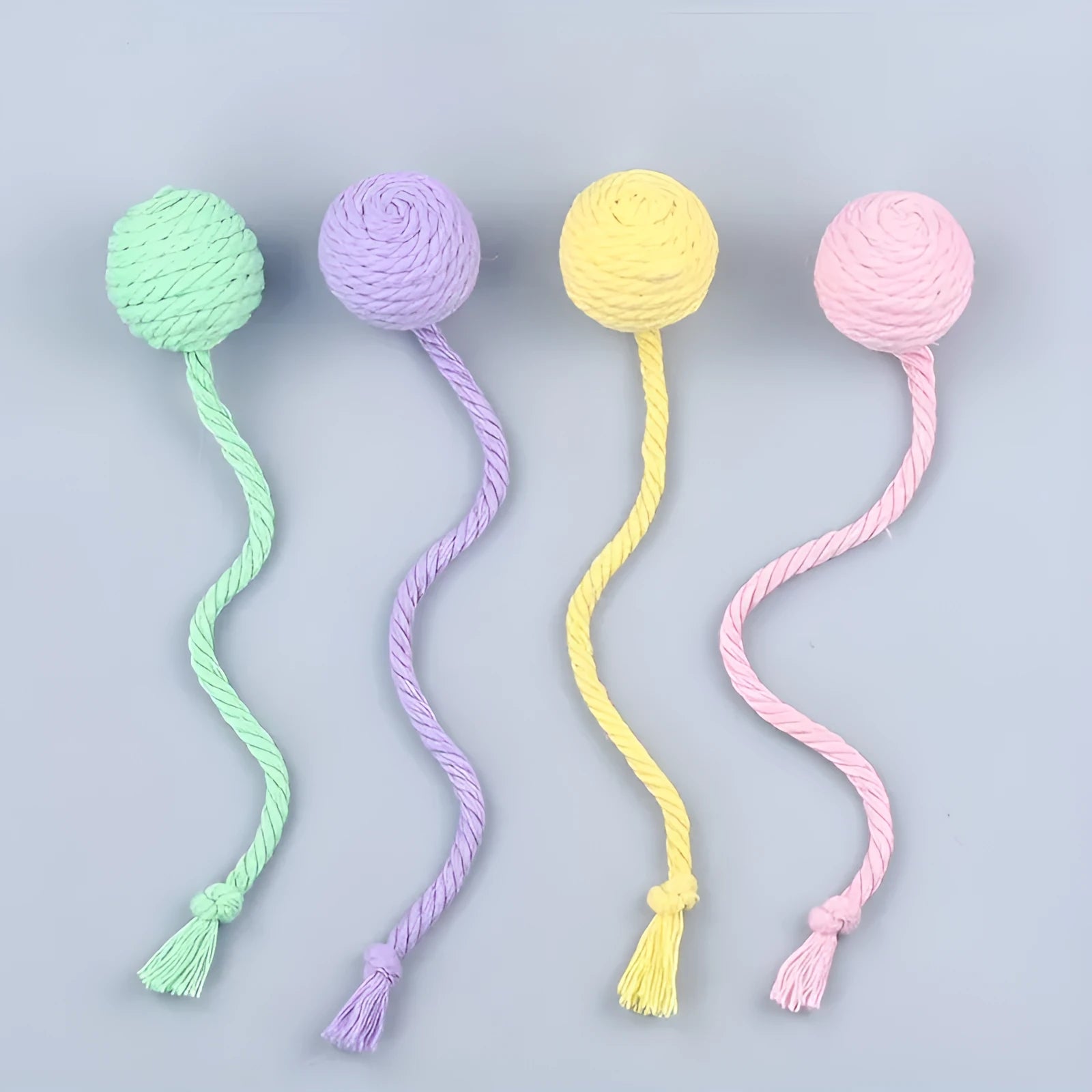 Cat toy ball with rope and bell in green pink purple yellow colours showing 3cm and 6cm size options