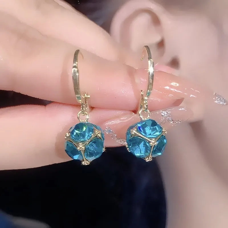 Geometric copper earrings with rose design elements and zircon detail in silver electroplated finish