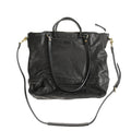 Black handmade vegetable tanned cowhide tote bag with zipper closure and large capacity for travel