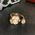 Adjustable vintage-style copper ring with gourd, flower, and bow design featuring inlaid zircon stones.