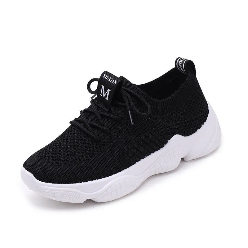 Women's white woven sports shoes with thick rubber sole and front strap.