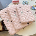 Rhombus embroidered bow design on nylon laptop storage bag showing colour and size options
