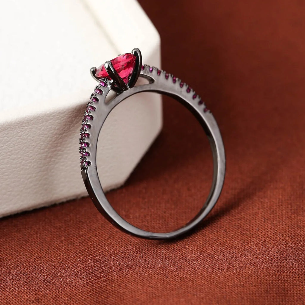 Geometric hexagon zircon ring on copper band in a gold and rose red electroplated finish.
