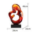 Transparent resin sculpture ornament in modern simplicity style showing orange red or blue colour options