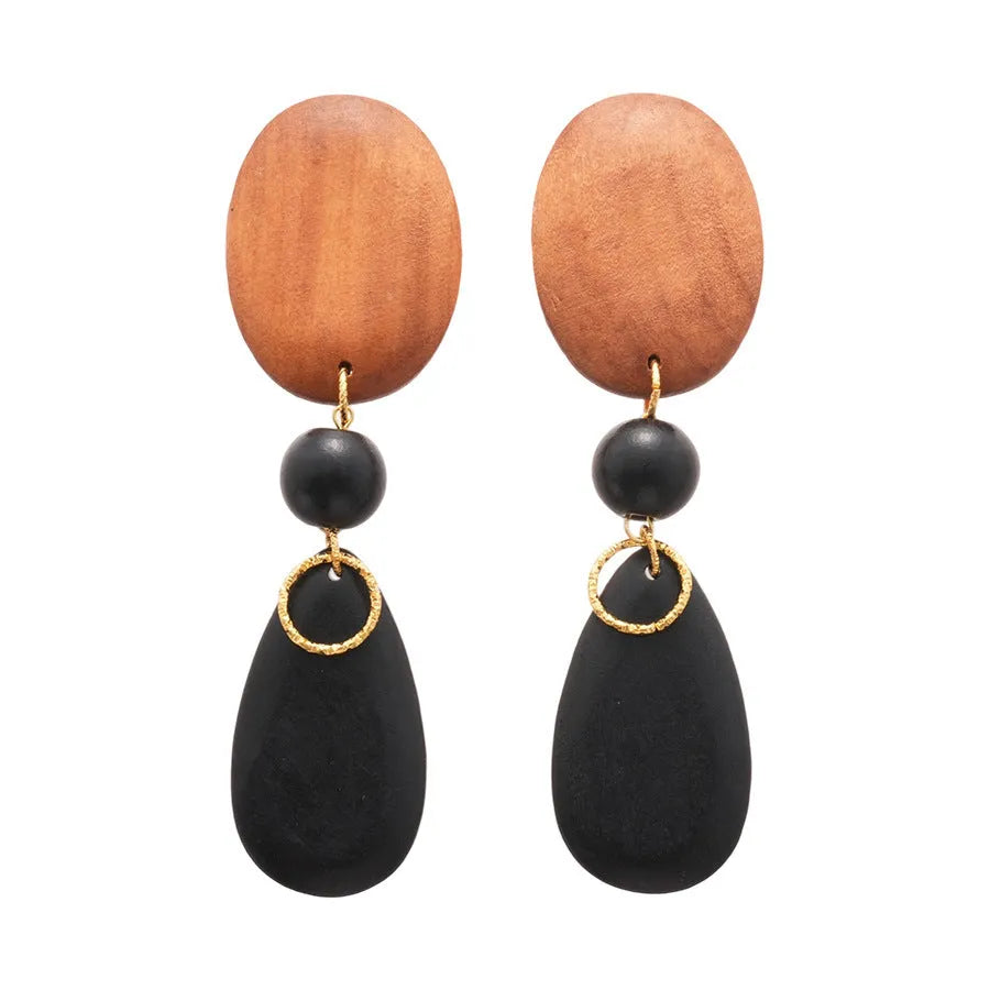 Pair of brown and black wooden elliptical retro style earrings on a silver backing.