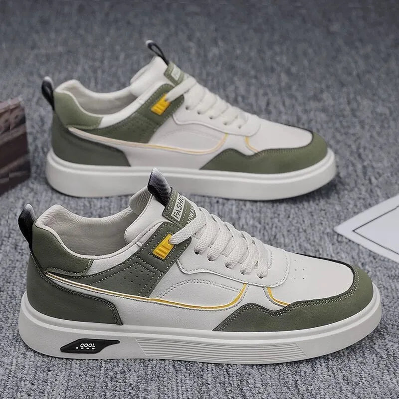Men's low-top canvas board shoes in solid colour with leather stitching detail on a neutral background.
