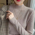 Viscose slim fit long sleeve pullover top in apricot colour on a hanger