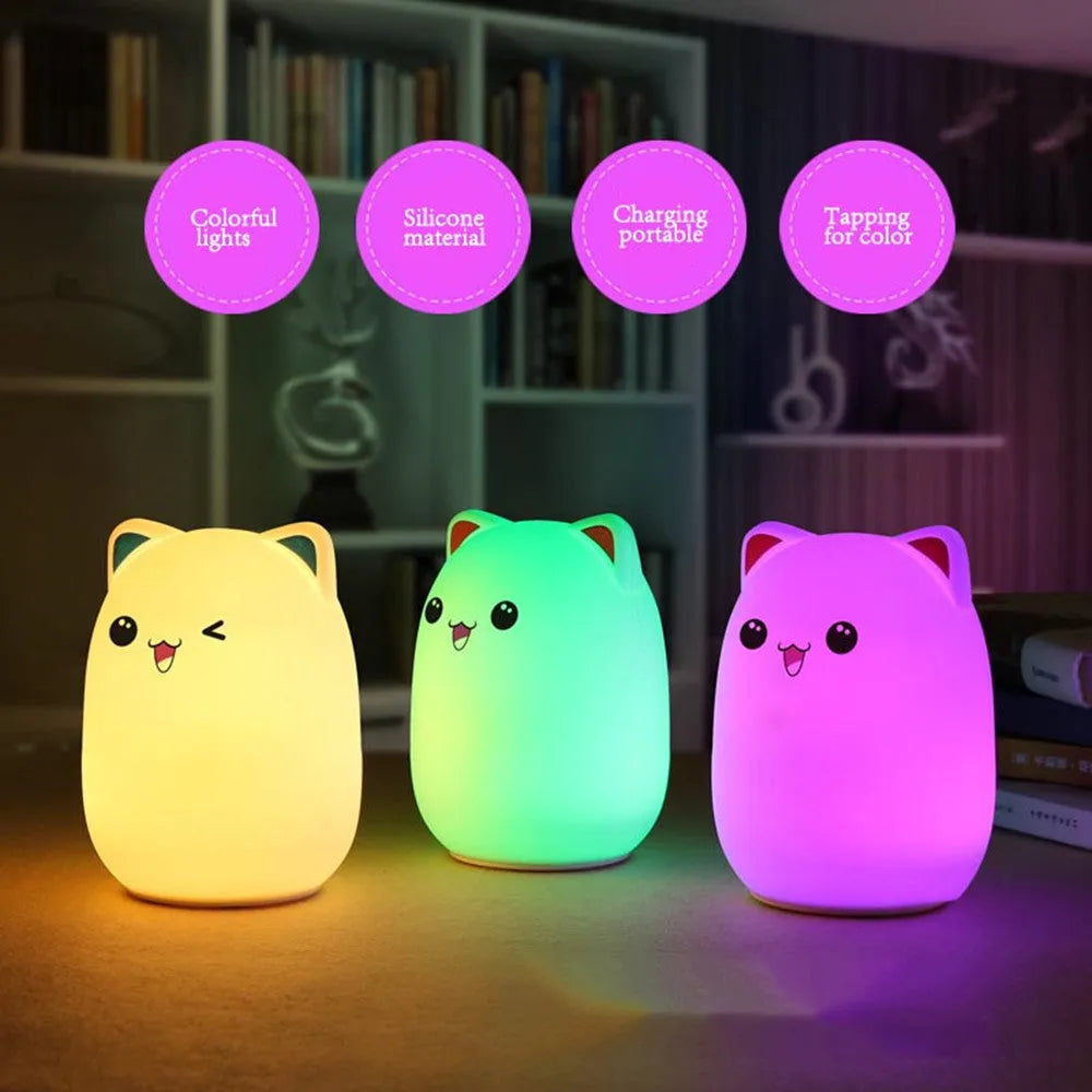 Cartoon silicone clapping lamp in Princess Bear style showing warm white light on a wooden table
