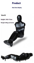 Black patent leather BDSM restraint set with full body wrap and six ratchet straps