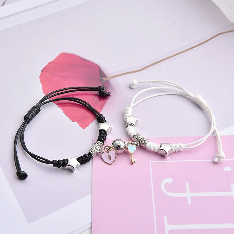 Alloy magnetic suction bracelet pair for couples with symbolic design options