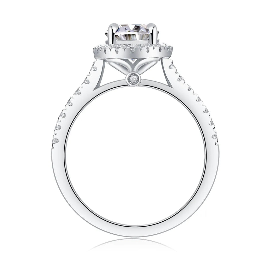 Egg-shaped 7x9mm moissanite wedding ring in S925 silver with platinum plating on white background