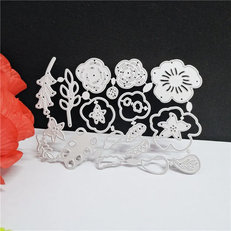 Silver carbon steel flower cutting die for papercraft measuring 14.3 by 9.9 centimetres
