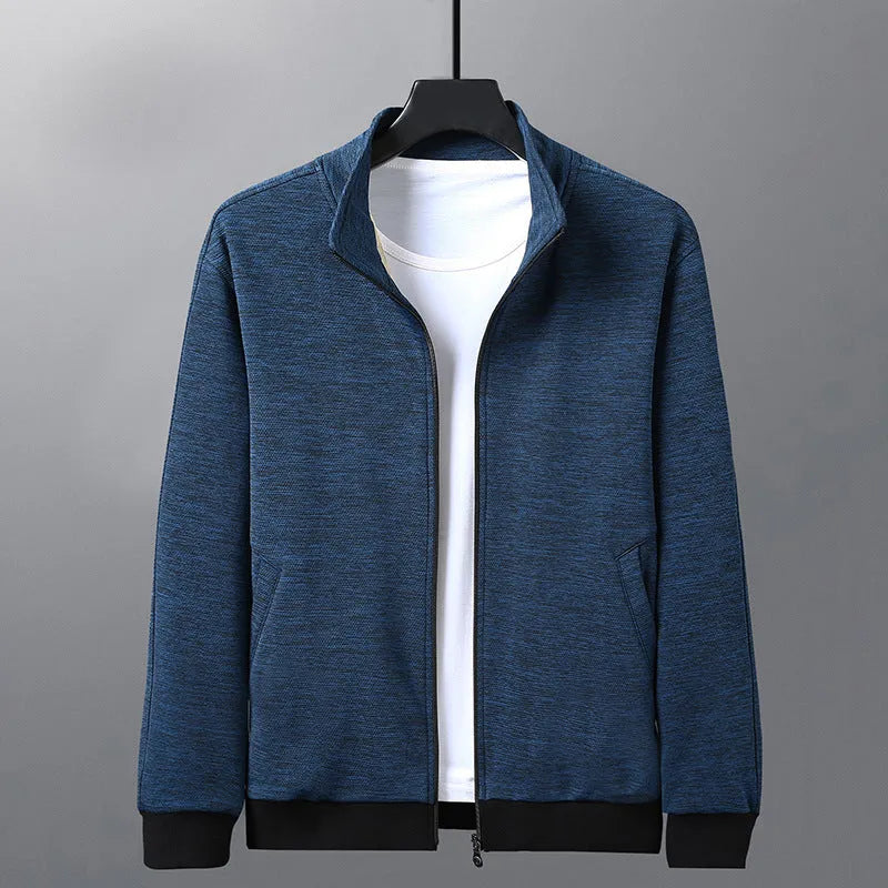 Man wearing a grey stand-up collar casual zip-front jacket with an athletic fit.
