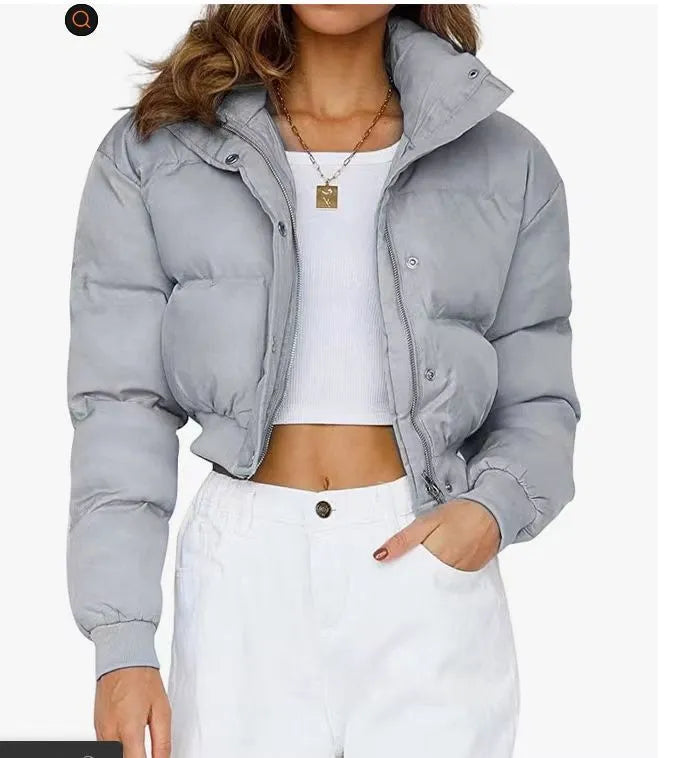 Women's loose fit long sleeve polyester jacket in blue, shown on a hanger.