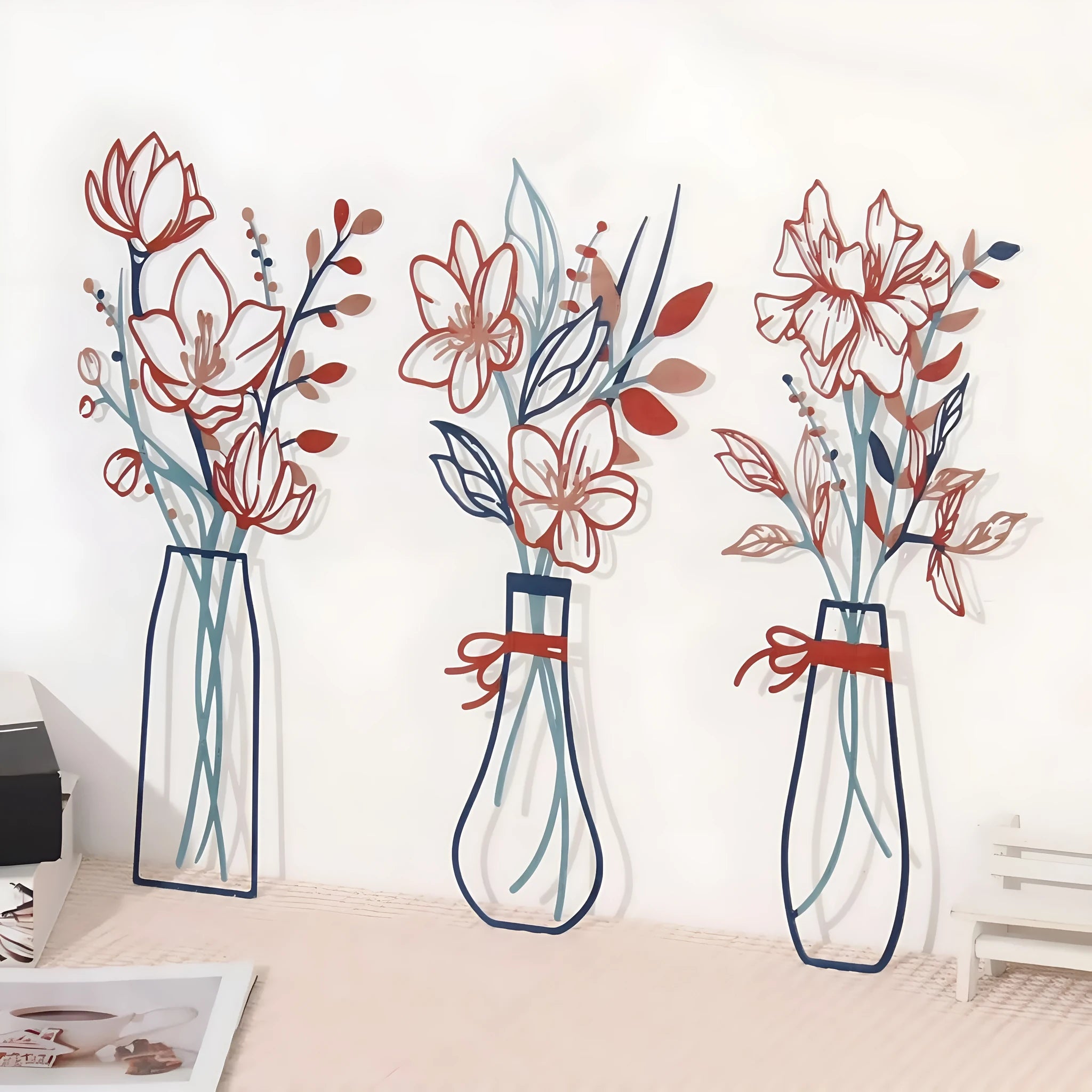 Set of three metal flower wall art decorations in modern style for country or farmhouse interiors.