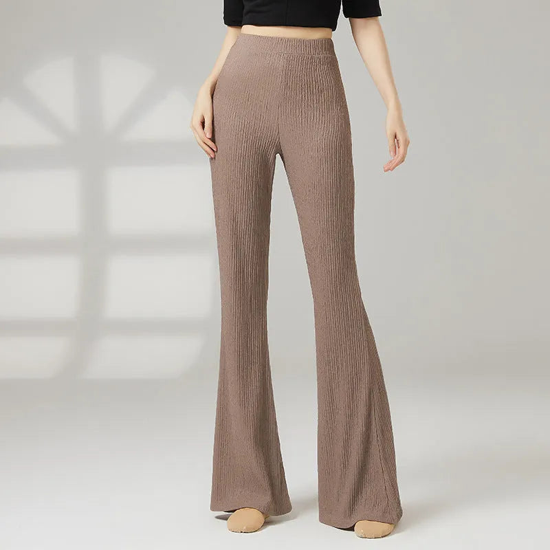 Women's solid colour dance practice pants in stretch polyester fabric on a hanger.