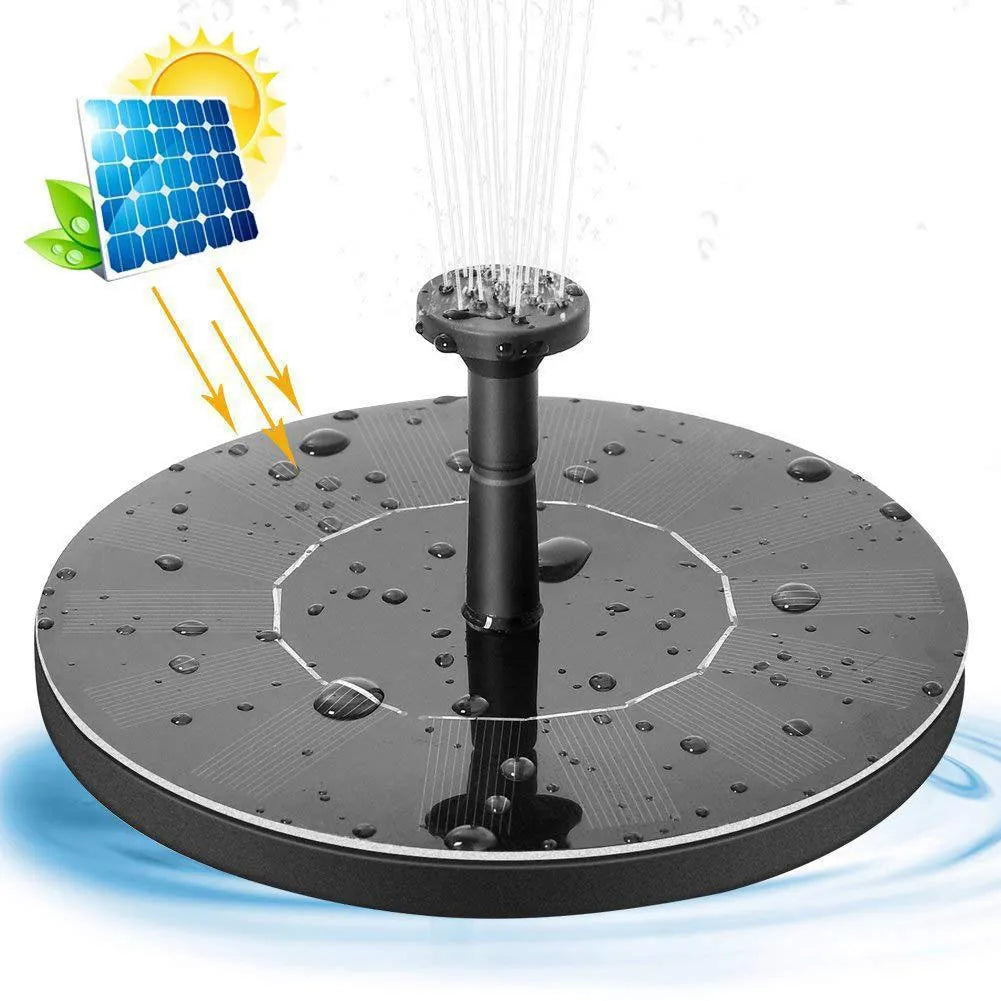 Solar floating fountain with round black panel and four spray nozzles on water surface
