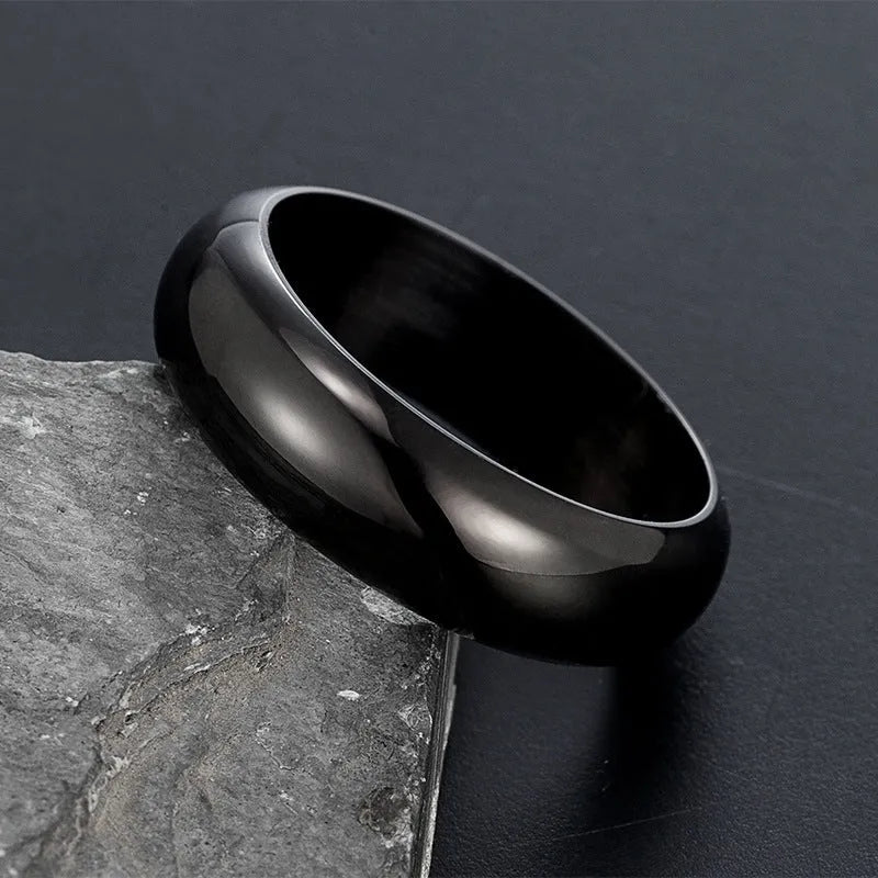 Glossy electroplated titanium steel ring in gold, black, and steel colour showing size range 7-12