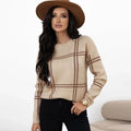 Women's loose fit plaid sweater with colour-block stripes in apricot, black, beige, red, and green.