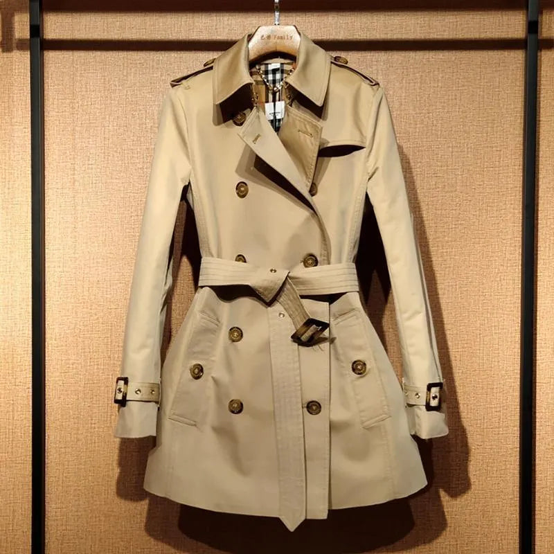 Khaki women's trench coat with double-breasted button front and structured flight sleeves