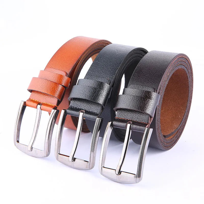 Leather pin buckle belt in black and camel colours on a plain background