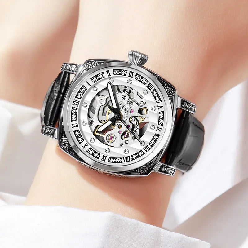 Mechanical watch with luminous hands on a leather strap, shown in black, red, steel, and white colour options.
