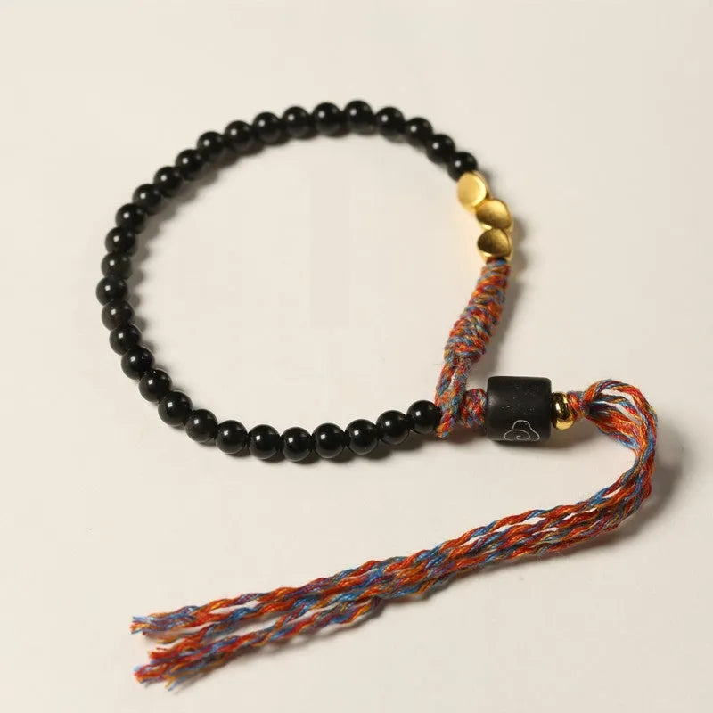 Hand-woven obsidian carrying strap showing 4mm width and textured surface
