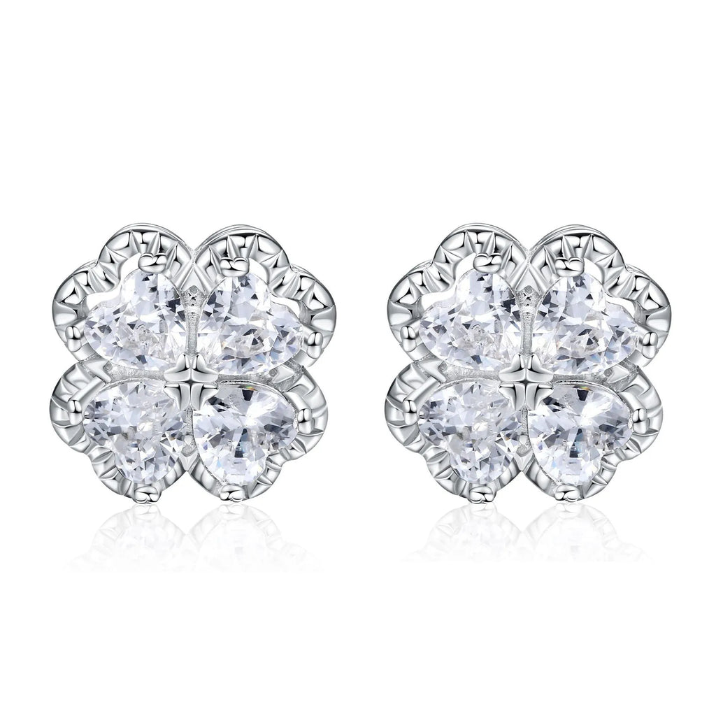 Pair of heart-shaped sterling silver earrings with four-leaf clover design and white gold colour finish.