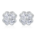 Pair of heart-shaped sterling silver earrings with four-leaf clover design and white gold colour finish.