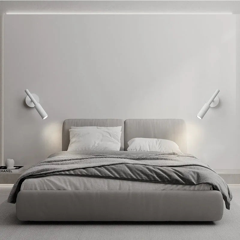 Modern wrought iron wall lamp in black or white finish, showing three colour light options.