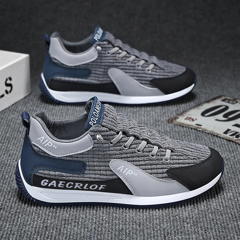 Men's grey and green mesh running shoes with lace-up closure and round toe
