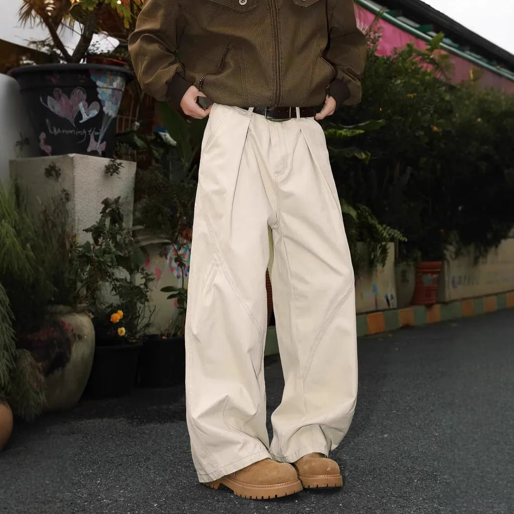 Men's straight-cut cotton trousers in black, brown, and apricot colours with striped pattern and pleated detailing