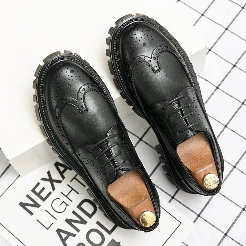 Men's black leather brogue shoes with round toe design on solid background