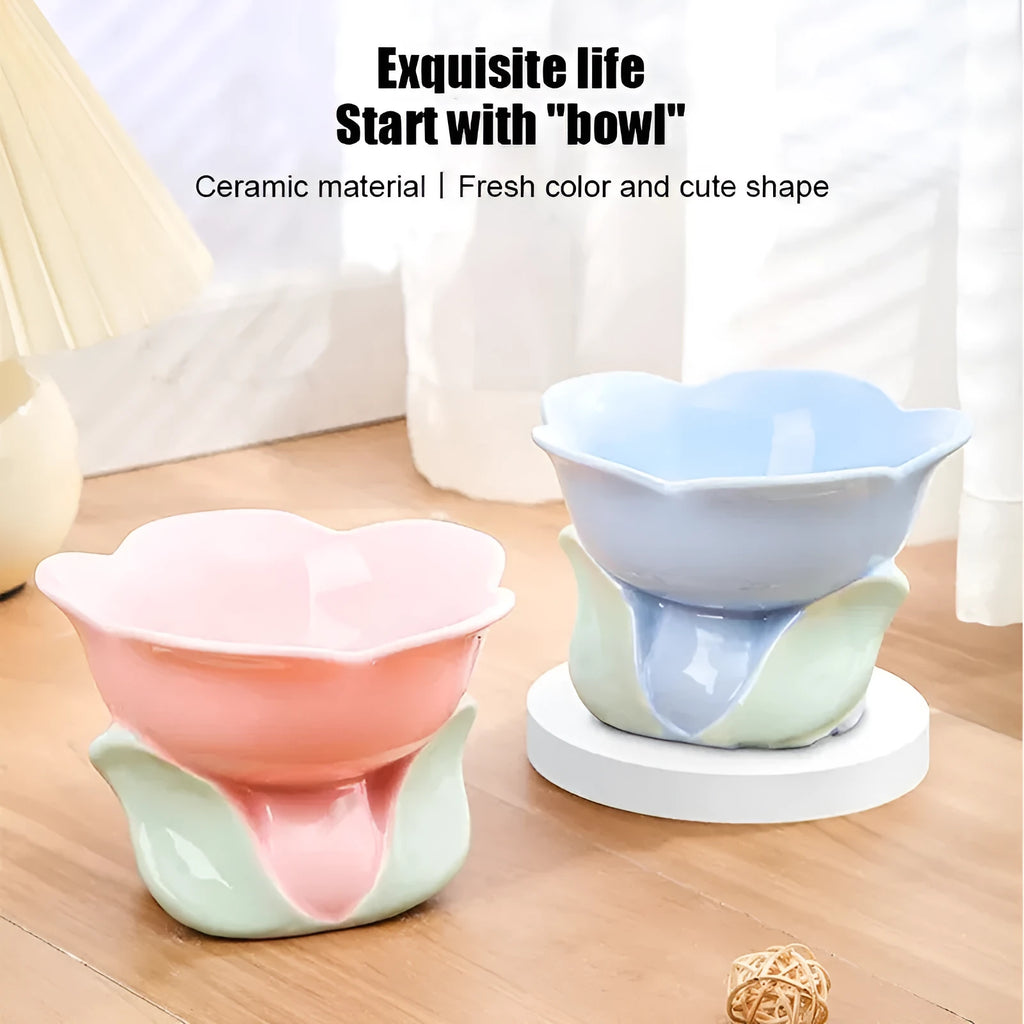 Blue ceramic raised pet bowl with floral pattern and non-slip base for cats and small dogs.