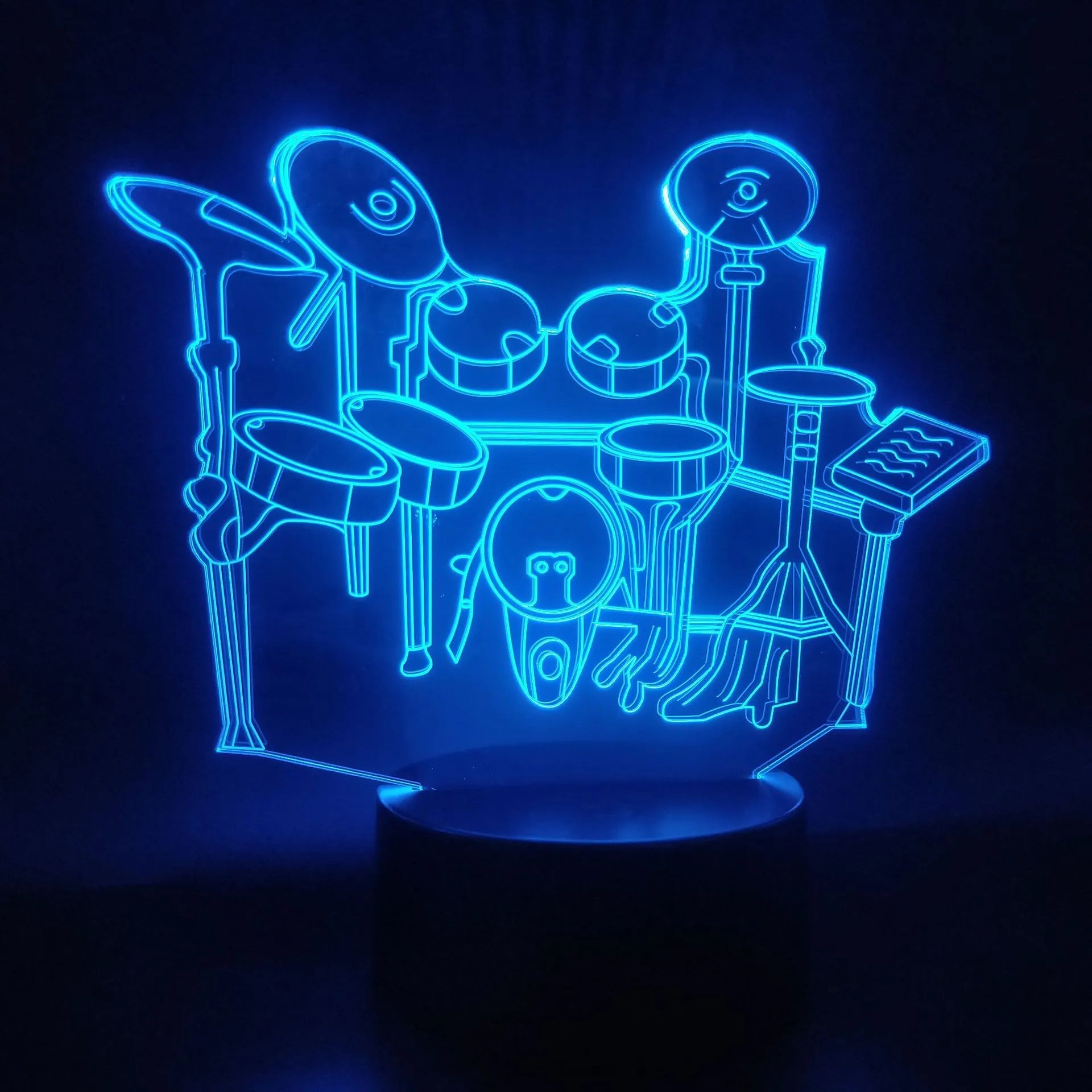 Drum kit 3D night light with seven colour modes, acrylic board, and ABS base on a desk