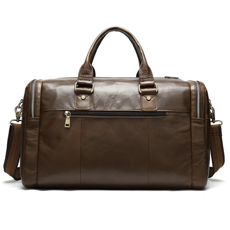 Coffee first layer cowhide leather travel bag with soft handle and zip closure on a plain background