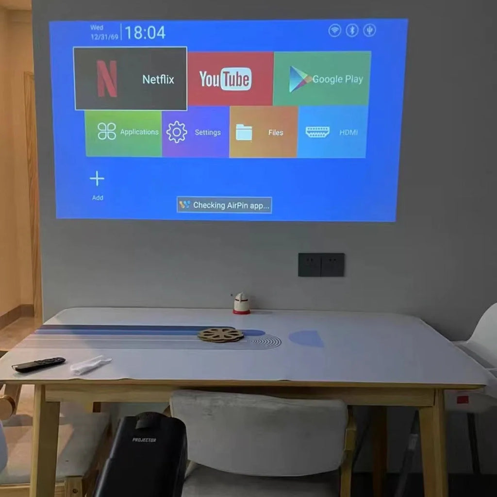 Wireless game machine projector with 720p HD resolution showing international power compatibility symbols
