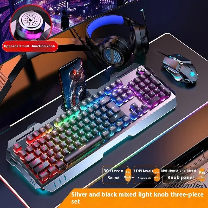 Aluminium mechanical gaming keyboard with rotary knob, shown in metal grey with rainbow backlighting.